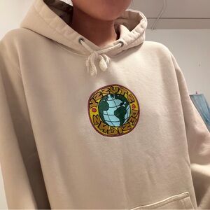 Stussy Cream Hoodie with Globe Design
